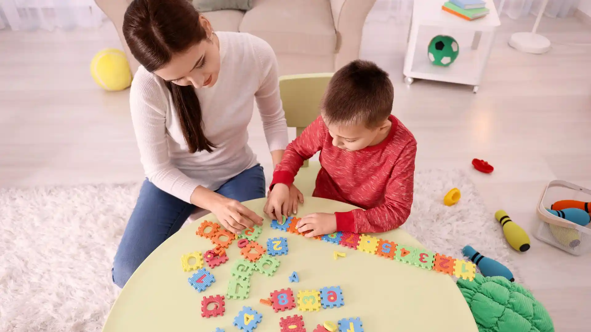 Image of Nanny with child in playroom 